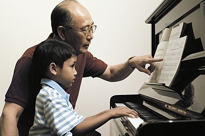  Grandparent with Grandson at Piano